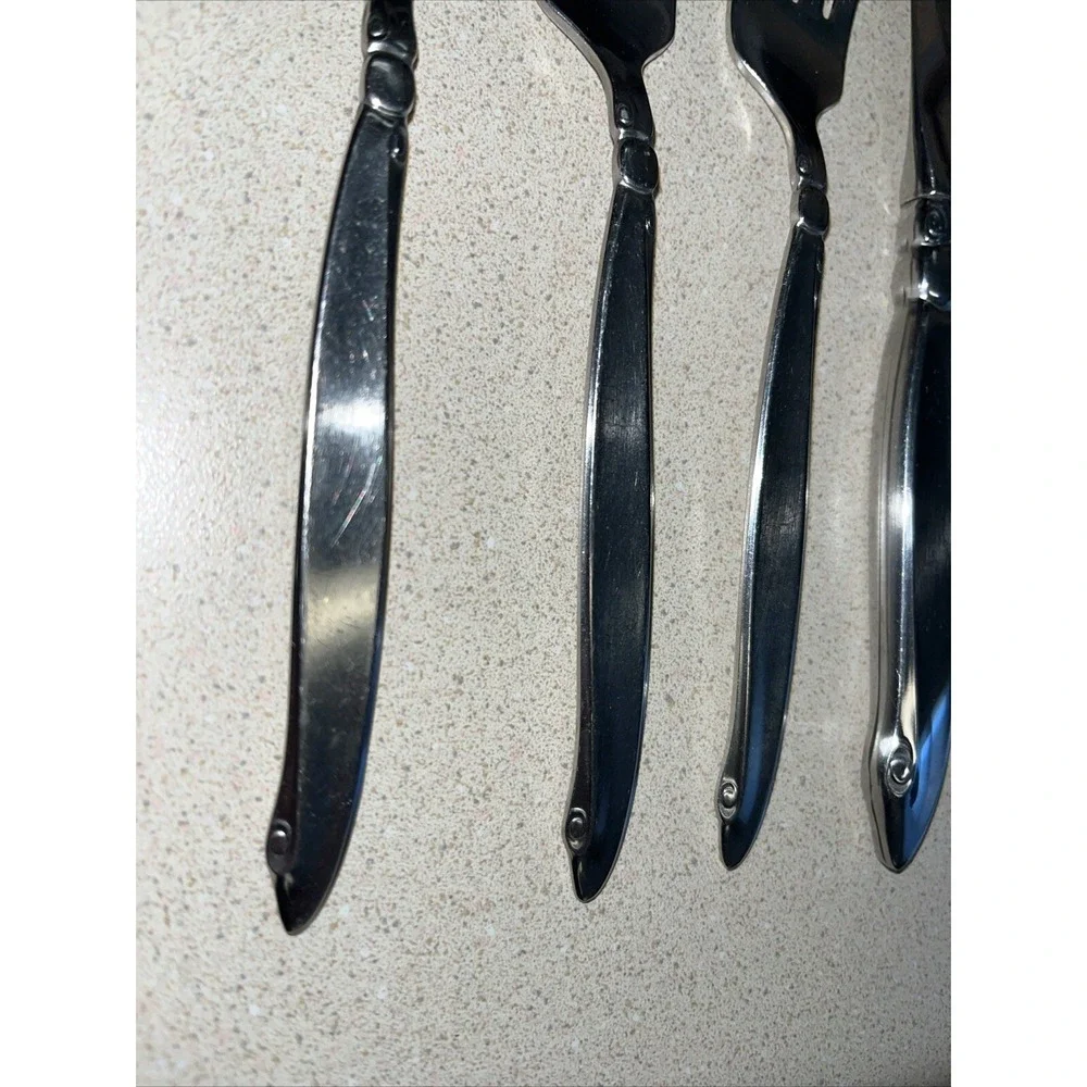 9 Piece Set ONEIDACRAFT PREMIER STAINLESS SHORELINE 3 Forks, 1 Knife & 5 Spoons.